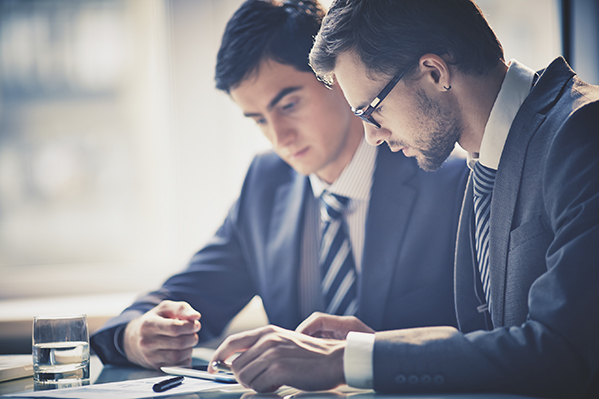 two business men reviewing documents